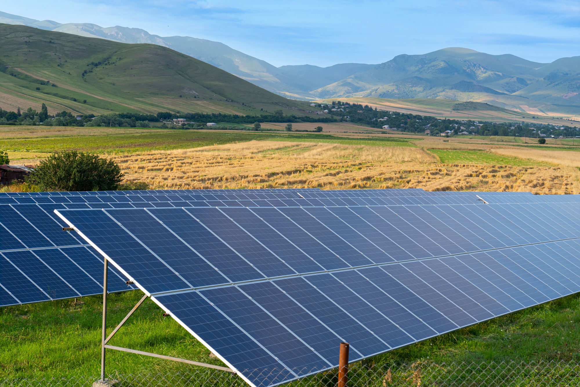 solar-plant-that-is-located-inside-a-valley-surrounded-by-mountains.jpg