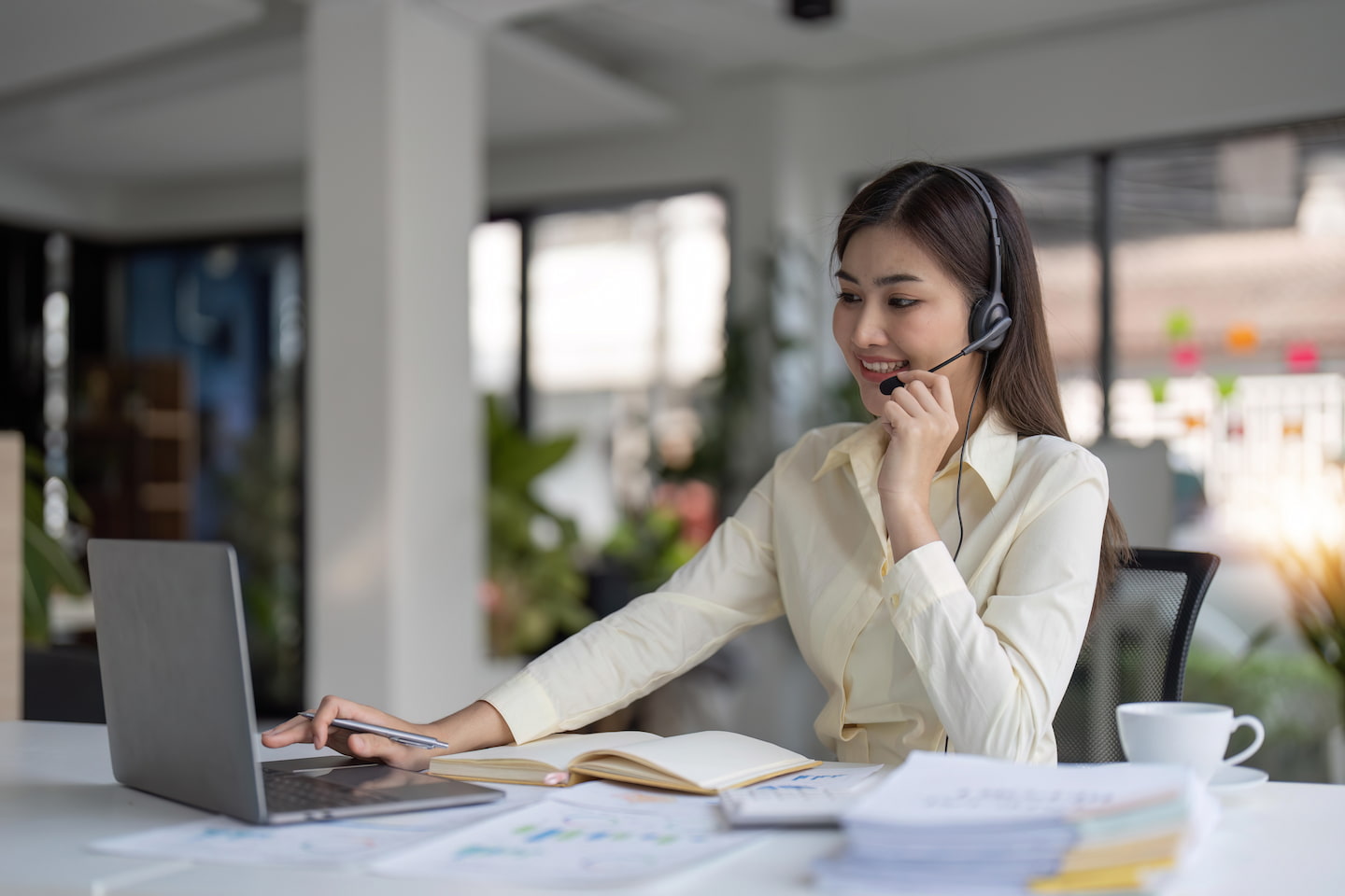 portrait-of-happy-smiling-female-customer-support-4DFRK25.jpg